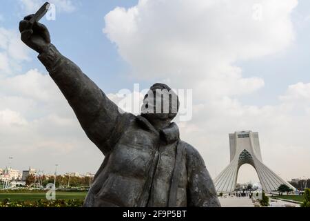 Statue of selfie making tourist at the Azadi Tower in Tehran, Iran. Stock Photo