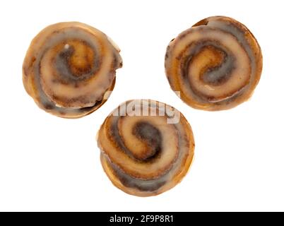 Top view of three bite size cinnamon swirl roll isolated on a white background. Stock Photo