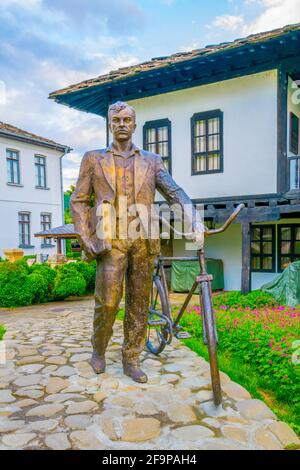 Statue of a man with bicycle in the bulgarian city Troyan Stock Photo