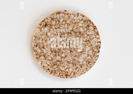 single rice cake isolated on white background, top view of puffed wholegrain crispbreads Stock Photo