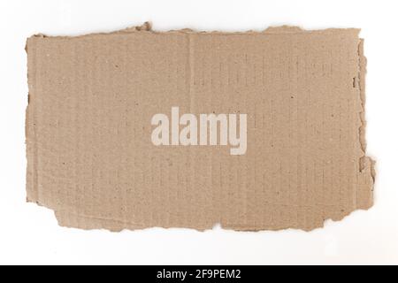 ripped piece of cardboard isolated on white background, cardboard with torn edges, top view Stock Photo