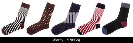 Five flat multi-colored striped and dotted cotton-blend socks isolated on a white background Stock Photo