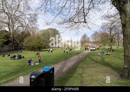 People relax on Christ's Pieces in Cambridge city centre, UK, 18.04.21 Stock Photo