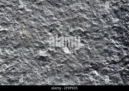 Closeup background of casting metal steel texture macro. Gray cast iron silver galvanized surface. Concept of lifeless desert surface of planet or Stock Photo