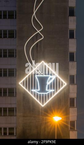 04.12.2019, Berlin, Berlin, Germany - Mitte - GDR-era neon sign with a steaming cup of coffee on the facade at the House of Statistics at Alexanderpla
