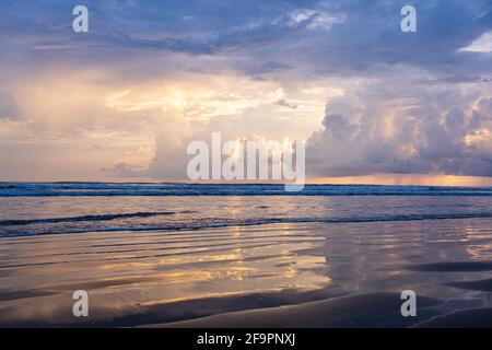 Rays of sun reflected on the water of the sea. Costa Rica Stock Photo