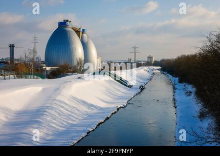 09.02.2021, Dortmund, North Rhine-Westphalia, Germany - Sunny winter landscape in the Ruhr area, ice and snow at the renaturalized Emscher, digested w Stock Photo