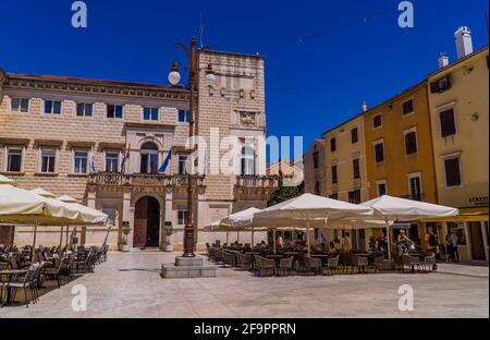 Zadar, Croatia - July 11, 2020 - people sitting on terraces in the old town of Zadar, Croatia Stock Photo