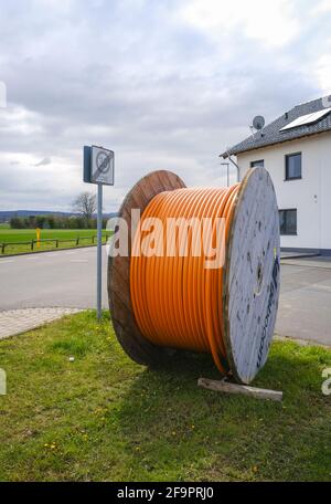Rheinbach, North Rhine-Westphalia, Germany - Internet broadband expansion, construction site laying fibre optic cable underground, cable drum with fib Stock Photo
