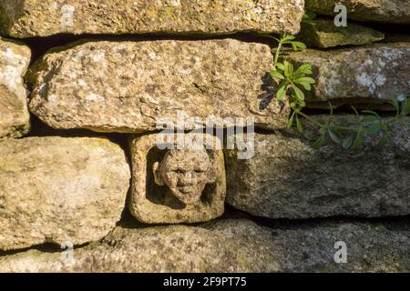 Cotswold dry stone wall with signature insert, Gloucestershire, UK Stock Photo