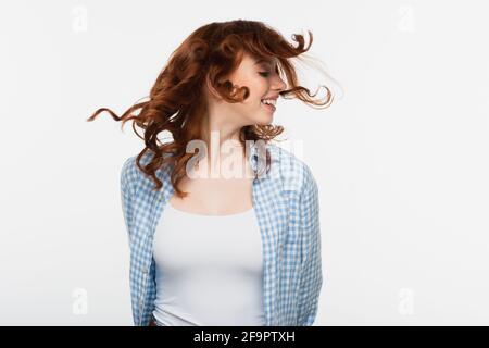cheerful redhead woman shaking head isolated on white Stock Photo