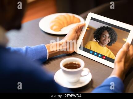 Virtual Date. Black Man Having Video Call With Girlfriend On Digital Tablet Stock Photo