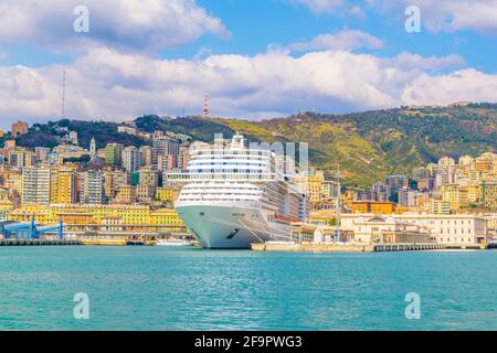 view of a cruise ship anchoring in the port of genoa in italy. Stock Photo