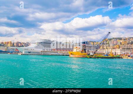view of a cruise ship anchoring in the port of genoa in italy. Stock Photo