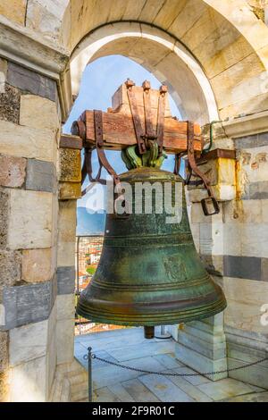 view of a bell situated on top of the leaning tower in pisa Stock Photo