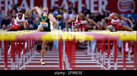 COMMONWEALTH GAMES 30/7/2002 MENS 110m HURDLES FINAL L-R TONY JARRETT WINNER SHAUN BOWNES (RSA) ALLEN CHARLES (CAN)  AND COLIN JACKSON PICTURE DAVID ASHDOWNCOMMONWEALTH GAMES MANCHESTER Stock Photo