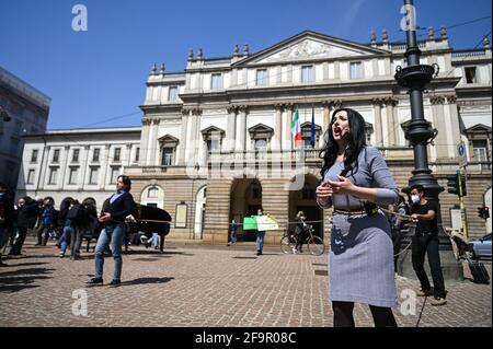 Milan, Italy. 20th Apr 2021. Opera singer Marina Nachkebiya performs during a flashmob in front of Teatro alla Scala theatre in Milan Italy on April 20, 2021 to raise awareness on the conditions of entertainment business workers due to the pandemic Credit: Piero Cruciatti/Alamy Live News Stock Photo
