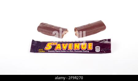 5th Avenue Candy Bar from The Hershey Company with Peanut Butter Crunch and Milk Chocolate out of Wrapper isolated on White Stock Photo