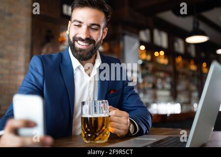 Young business man having a break in a restaurant. Work occupation business lifestyle concept Stock Photo
