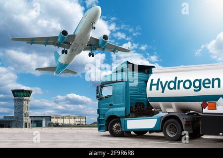 Airplane and truck with hydrogen tank trailer on the background of airport. Clean mobility concept Stock Photo