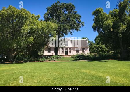 Historical Rhone Homestead Manor house from 1795 in cape dutch architecture style at Boschendal farm near Franschhoek, South Africa, against blue sky Stock Photo