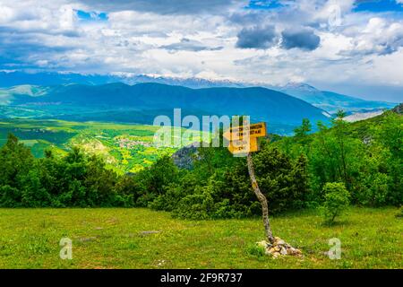 a wooden sign post showing direction to the matka lake in macedonia Stock Photo