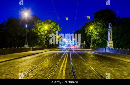 Night view of illuminated maximilianstrasse in bavarian capital munich which leads towrds maximilianeum building. Stock Photo