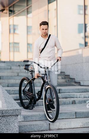 Manager on way to work in urban and eco transport, healthy lifestyle in morning Stock Photo