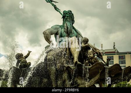 13 May 2019 Berlin, Germany - Neptune fountain (Neptunbrunnen) on Alexanderplatz. Neptune fountain (Neptunbrunnen) on Alexanderplatz in Berlin Stock Photo