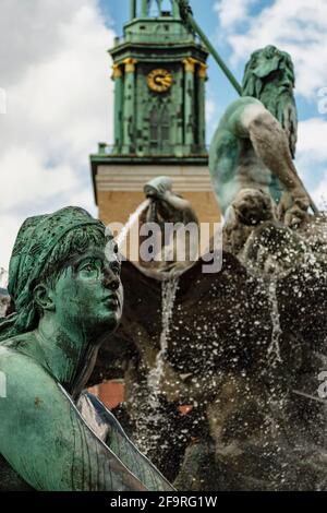 13 May 2019 Berlin, Germany - Neptune fountain (Neptunbrunnen) on Alexanderplatz. Neptune fountain (Neptunbrunnen) on Alexanderplatz in Berlin Stock Photo