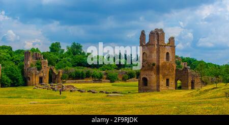 via appia used to be important trade route for antique merchants in ancient rome, nowadays leads thourgh fields among ancient gates, ruins and modern Stock Photo