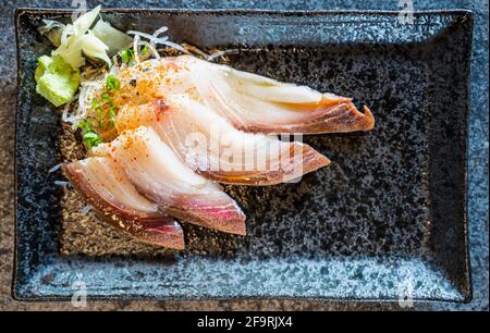 Hamachi or Amberjack sashimi at sushi bar in Northern Thailand Stock Photo