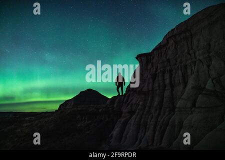 Watching The Aurora Borealis From Dinosaur Provincial Park Stock Photo