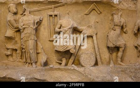 Rome. Italy. Frieze from the college of the Fabri Tignarii. The frieze shows a work scene in a carpenters' shop. The carpenters' guild, which had cons Stock Photo