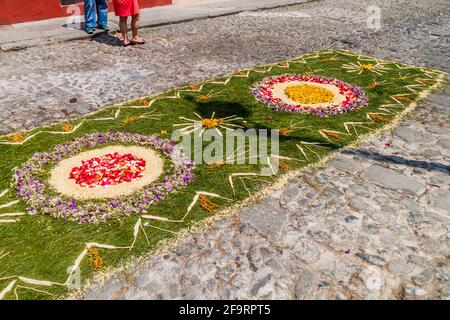 Decorated carpet on the street before the procession on Easter Sunday in Antigua Guatemala city. Stock Photo