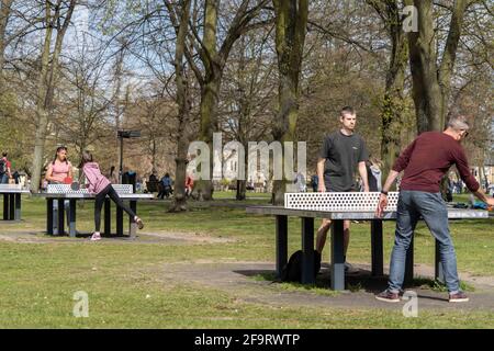Cambridge, Cambridgeshire, UK. 18th Apr, 2021. People seen playing table tennis on Christ's Pieces in Cambridge city center. Credit: Edward Crawford/SOPA Images/ZUMA Wire/Ģ����ý Live News Stock Photo
