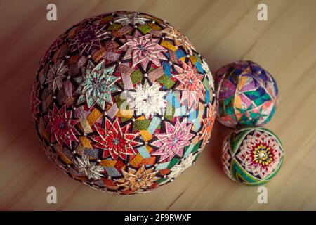 Temari balls, a handicraft ball in traditional Japanese style. Japanese culture. Closeup Christmas gift. Stock Photo