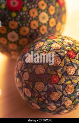 Temari balls, a handicraft ball in traditional Japanese style. Japanese culture. Closeup Christmas gift. Stock Photo