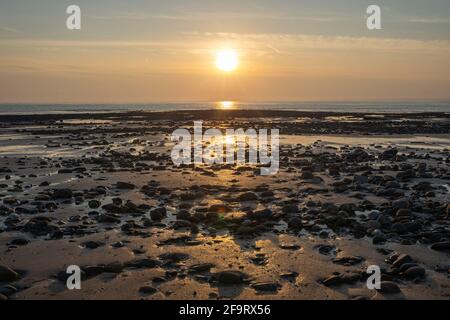 Whiteford sands beach stones at sunset, the Gower peninsula, Swansea, South Wales, UK. Coastline backdrop, no people Stock Photo