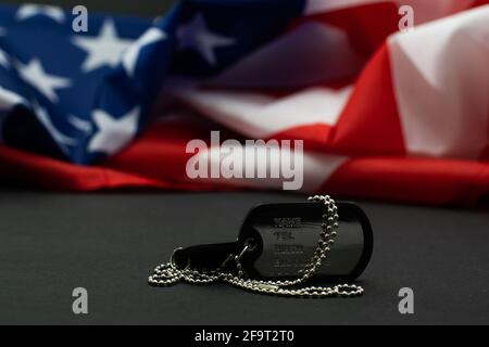 Soldier's token on American flag background Stock Photo