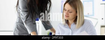 Businesswoman brought documents for signature to boss. Stock Photo