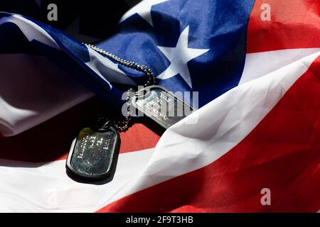 Soldier's token on American flag background Stock Photo