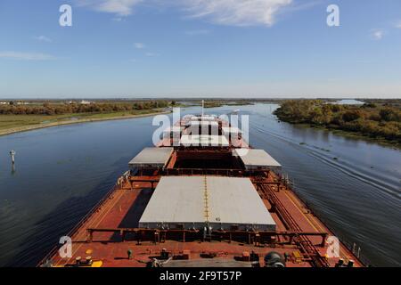 Bulk carrier vessel proceeding in inland waters for loading Stock Photo