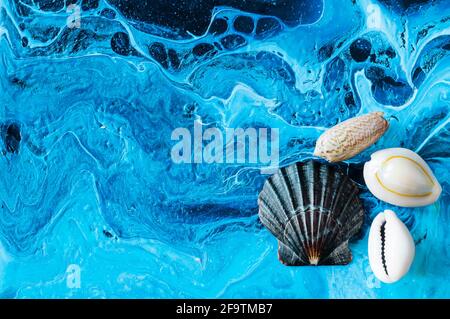Seashells on a bright background. Acrylic Pouring Stock Photo