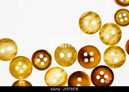 Brown  buttons on white background , different size of bright round buttons Stock Photo
