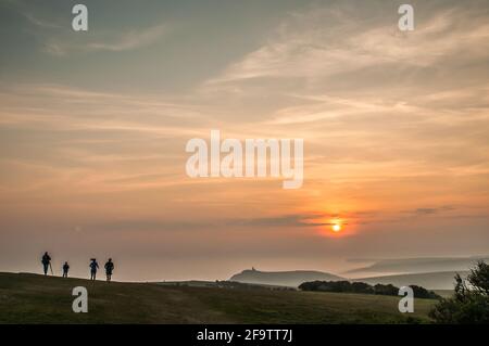 Eastbourne, East Sussex, UK. 20th Apr, 2021. Dense sea fog moves in after a bright warm sunny day. Quite spectacular views from higher up near Beachy Head looking West across the fog filled valleys. The Belle Tout lighthouse centre. Credit: David Burr/Alamy Live News Stock Photo