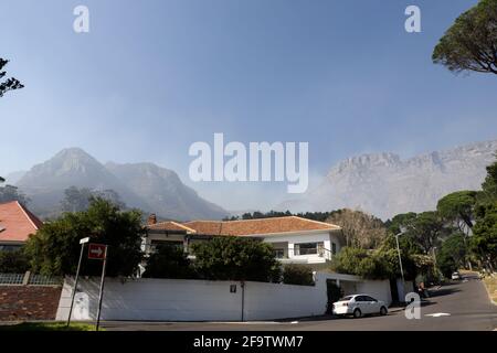 Cape Town, South Africa. 20th Apr, 2021. Smoke rises from Table Mountain near Vredehoek, Cape Town, South Africa, on April 20, 2021. The wildfire that broke out on South Africa's iconic Table Mountain on Sunday morning has been largely contained but the danger remains, the Western Cape provincial government said in a statement Tuesday. Credit: Lyu Tianran/Xinhua/Alamy Live News Stock Photo