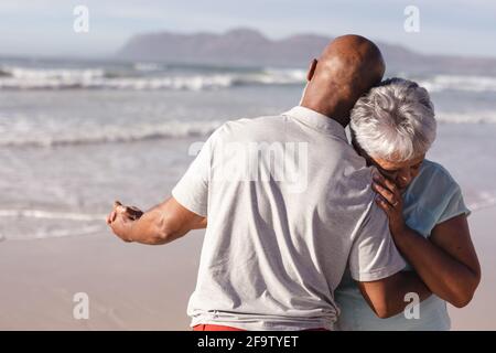 Close up of senior african american couple dancing together on the beach Stock Photo