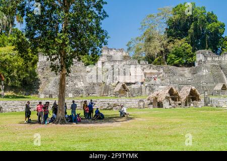 TIKAL, GUATEMALA - MARCH 14, 2016: Tourists at the Gran Plaza at the archaeological site Tikal, Guatemala Stock Photo