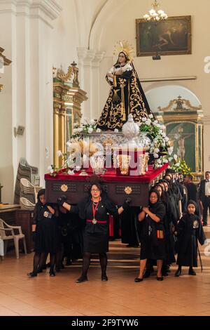 ANTIGUA, GUATEMALA - MARCH 26, 2016: Participants of the procession on Holy Saturday Black Saturday in Antigua Guatemala town, Guatemala. Stock Photo